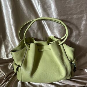 Cole Haan Green leather shoulder bag with side pockets.
